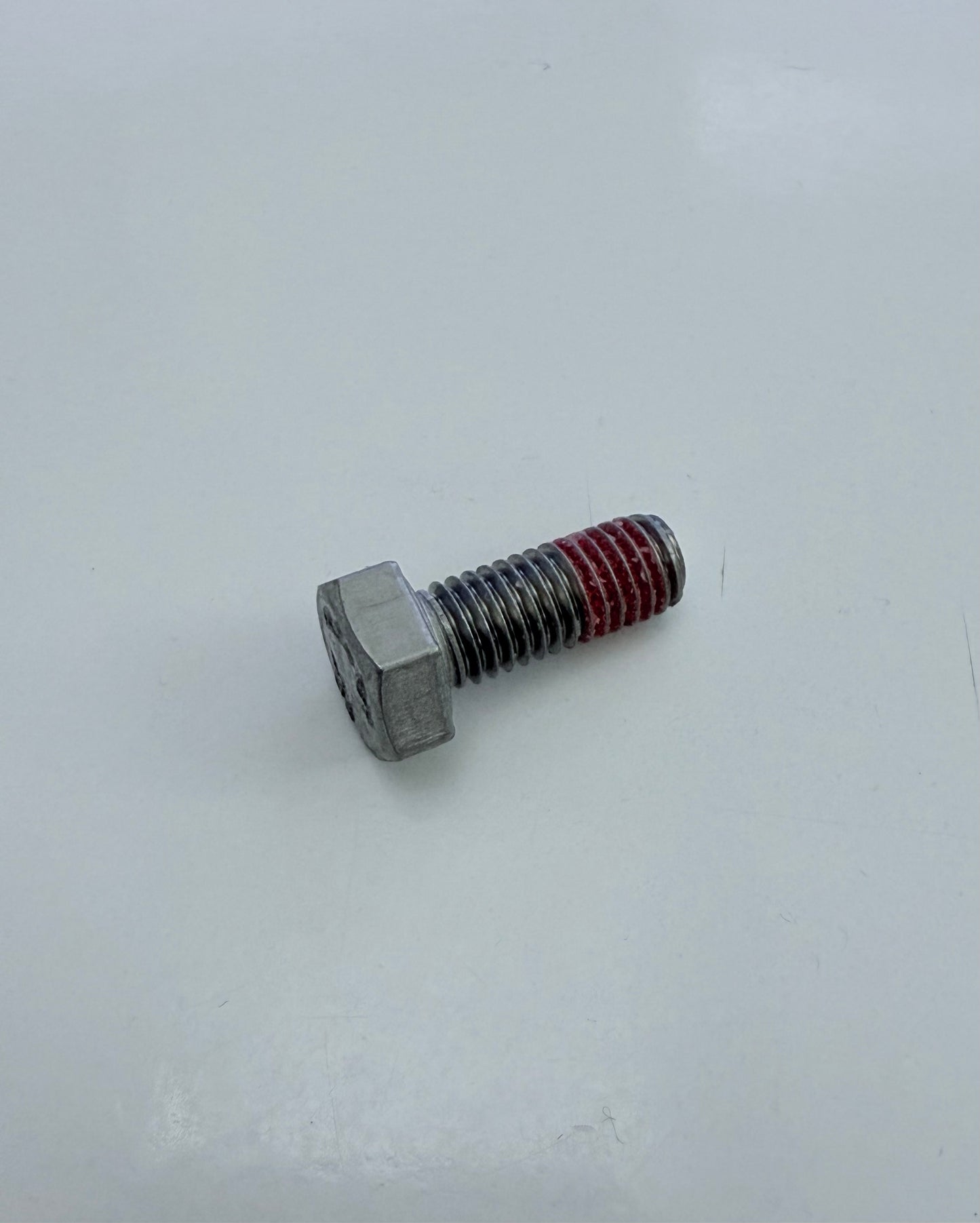 Shaft nut locking screw